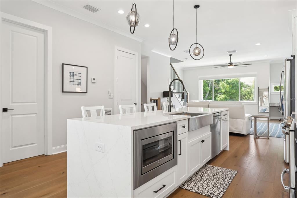4515 West North A Street, Unit 2 Tampa, FL 33609 - Photo 9 of 21 a large kitchen with stainless steel appliances a large center island attached withe living room