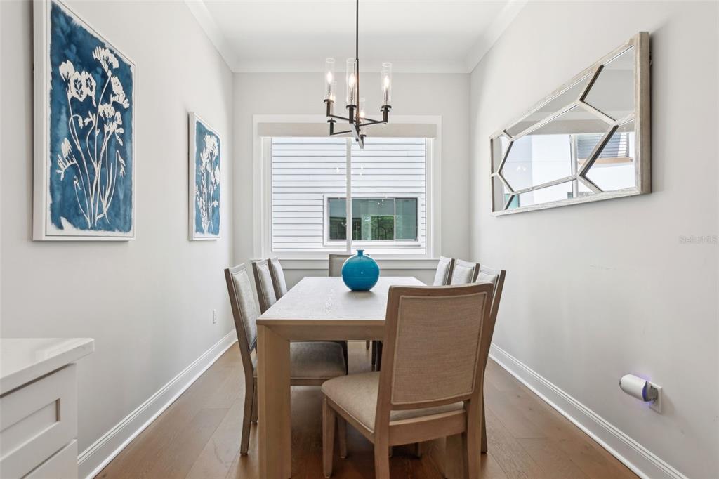 4515 West North A Street, Unit 2 Tampa, FL 33609 - Photo 10 of 21 a view of a dining room with furniture window and wooden floor