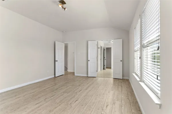 a view of a balcony with wooden floor