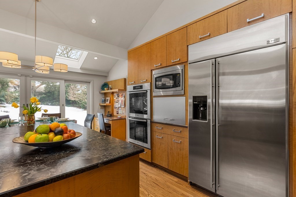 326 Highland Avenue Newton, MA 02465 - Photo 15 of 42 a kitchen with a refrigerator and a sink
