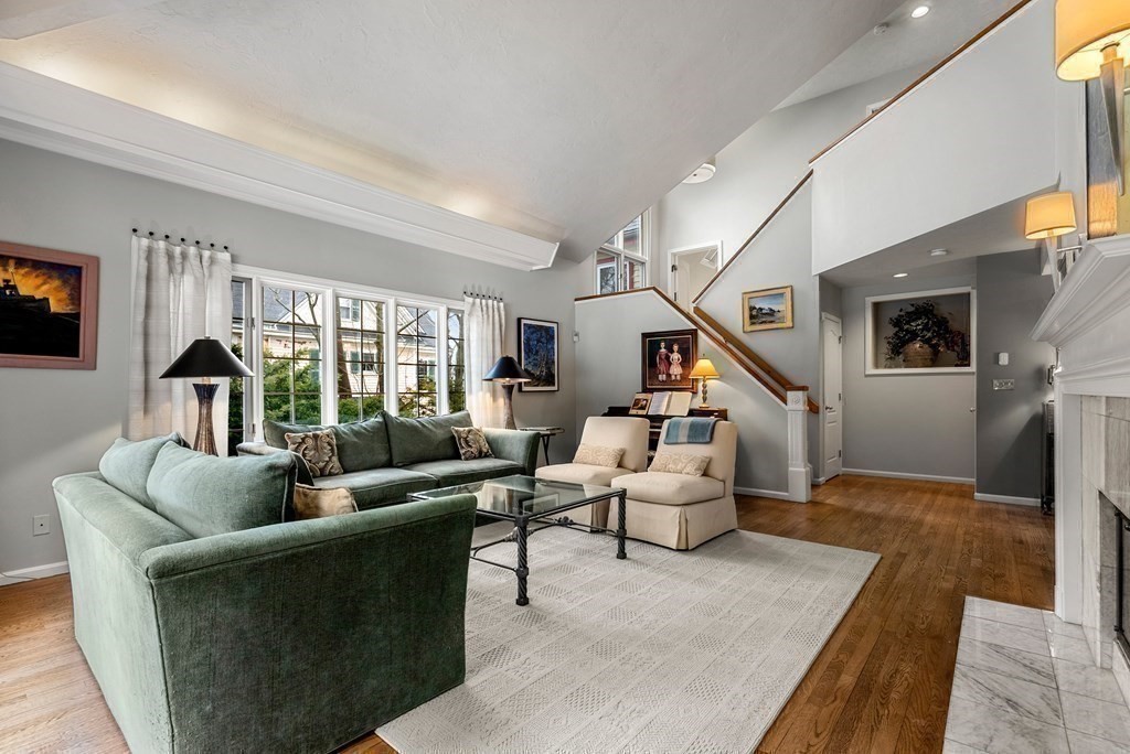 326 Highland Avenue Newton, MA 02465 - Photo 21 of 42 a living room with furniture wooden floor and a flat screen tv