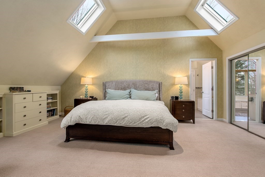 326 Highland Avenue Newton, MA 02465 - Photo 25 of 42 a spacious bedroom with a bed and a cabinets