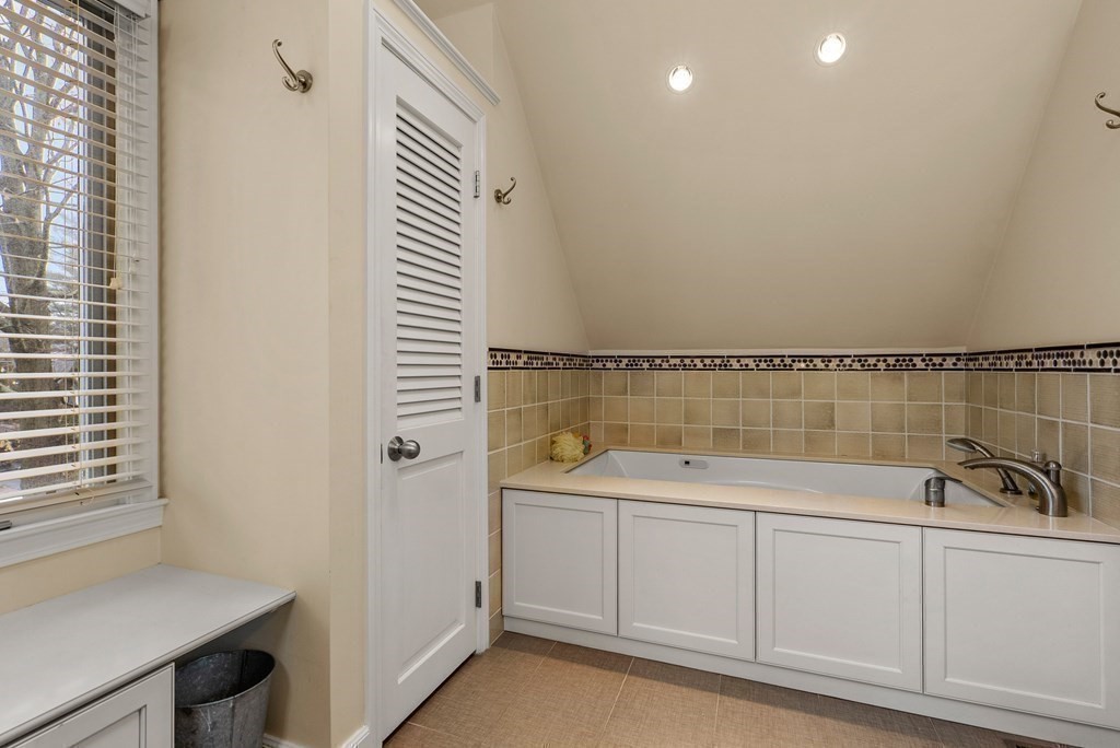 326 Highland Avenue Newton, MA 02465 - Photo 28 of 42 a bathroom with a sink and a bathtub