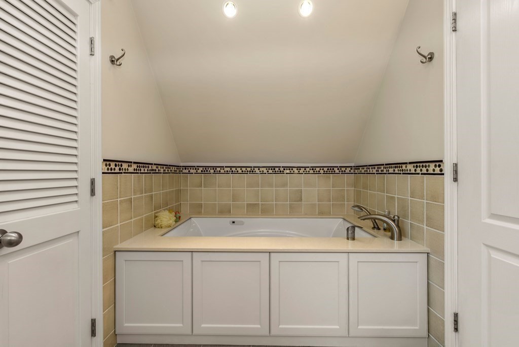326 Highland Avenue Newton, MA 02465 - Photo 29 of 42 a bathroom with a bathtub