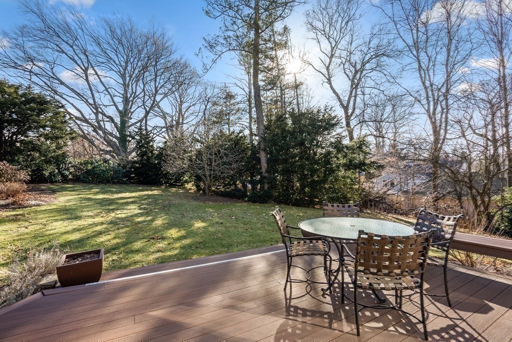 326 Highland Avenue Newton, MA 02465 - Photo 37 of 42 a view of a swimming pool with a table and chairs