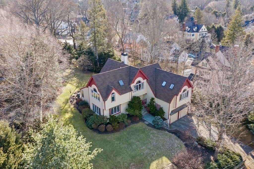 326 Highland Avenue Newton, MA 02465 - Photo 40 of 42 an aerial view of a house with a yard and large trees