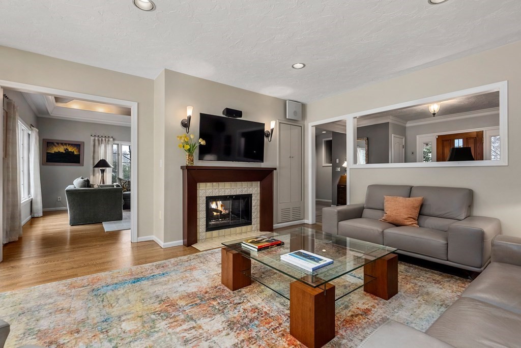 326 Highland Avenue Newton, MA 02465 - Photo 5 of 42 a living room with furniture and a fireplace