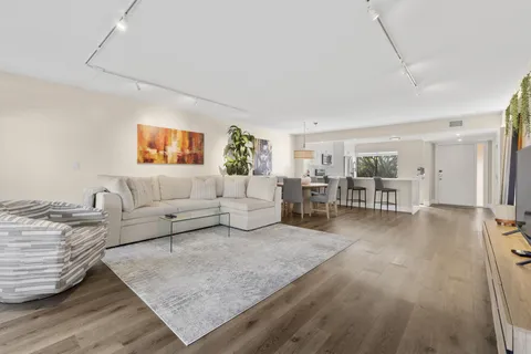 a living room with furniture and a table