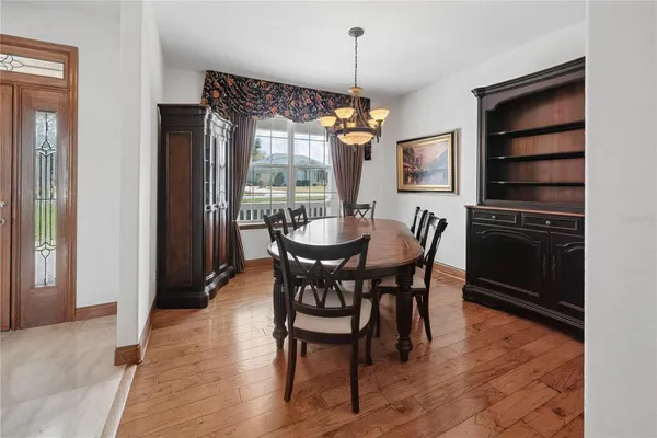 a kitchen with granite countertop a sink stove and refrigerator