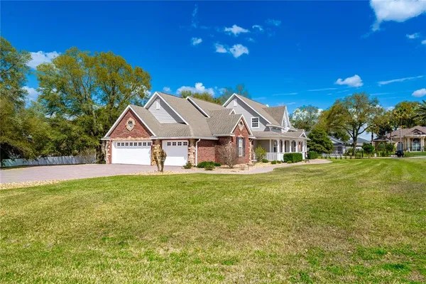 a view of a house with a big yard