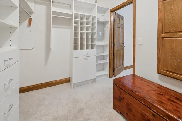 a white toilet sitting next to a bath tub