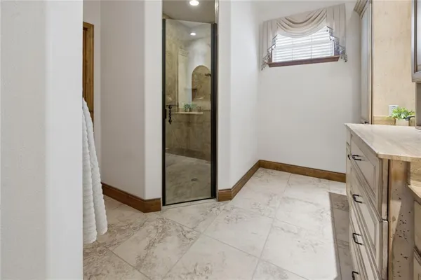 a view of a storage and utility room with washer and dryer