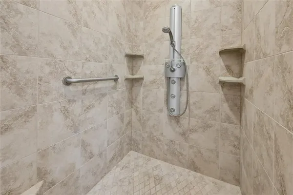 a view of a hallway with wooden floor and a sink