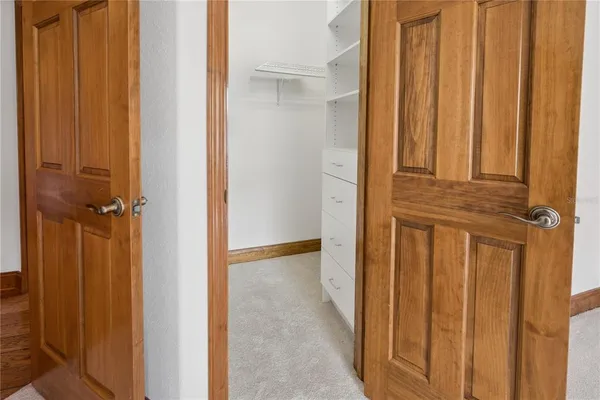 a view of a house with a wooden deck