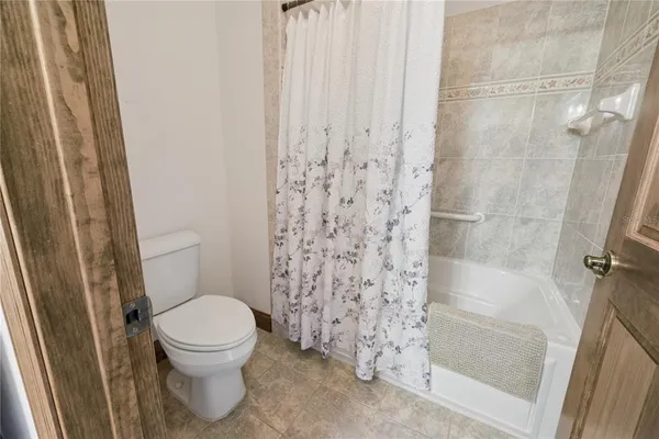 an aerial view of a house with a swimming pool