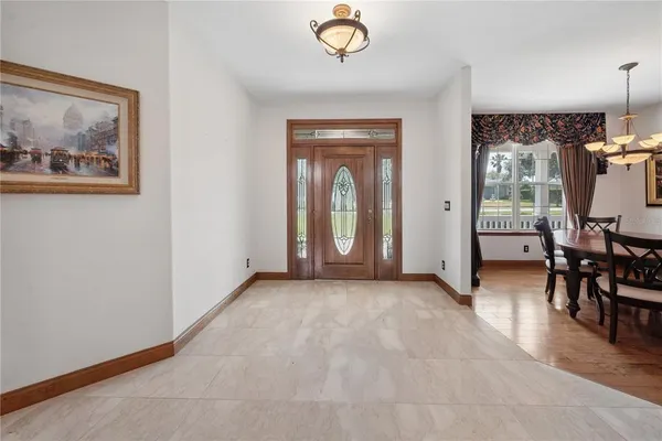 a living room with furniture fireplace and window