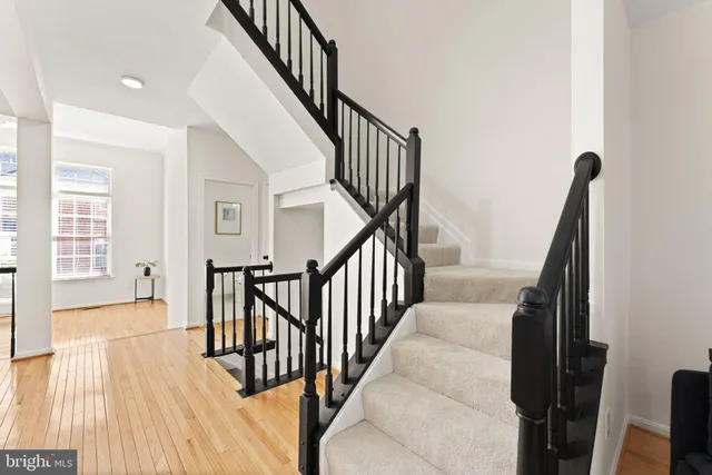 a kitchen with stainless steel appliances granite countertop a refrigerator stove and microwave