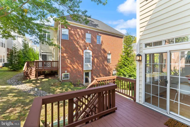 a white bath tub sitting in a bathroom next to a window