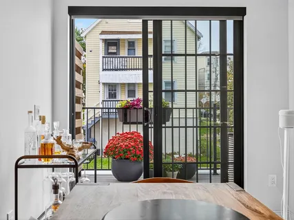 a view of a balcony with a potted plant