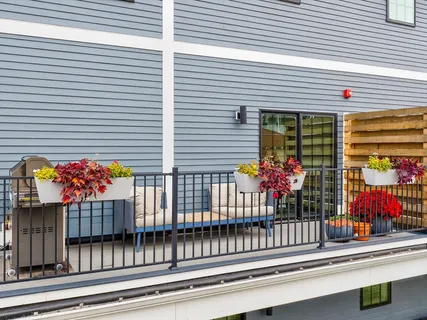 a view of a balcony with wooden floor