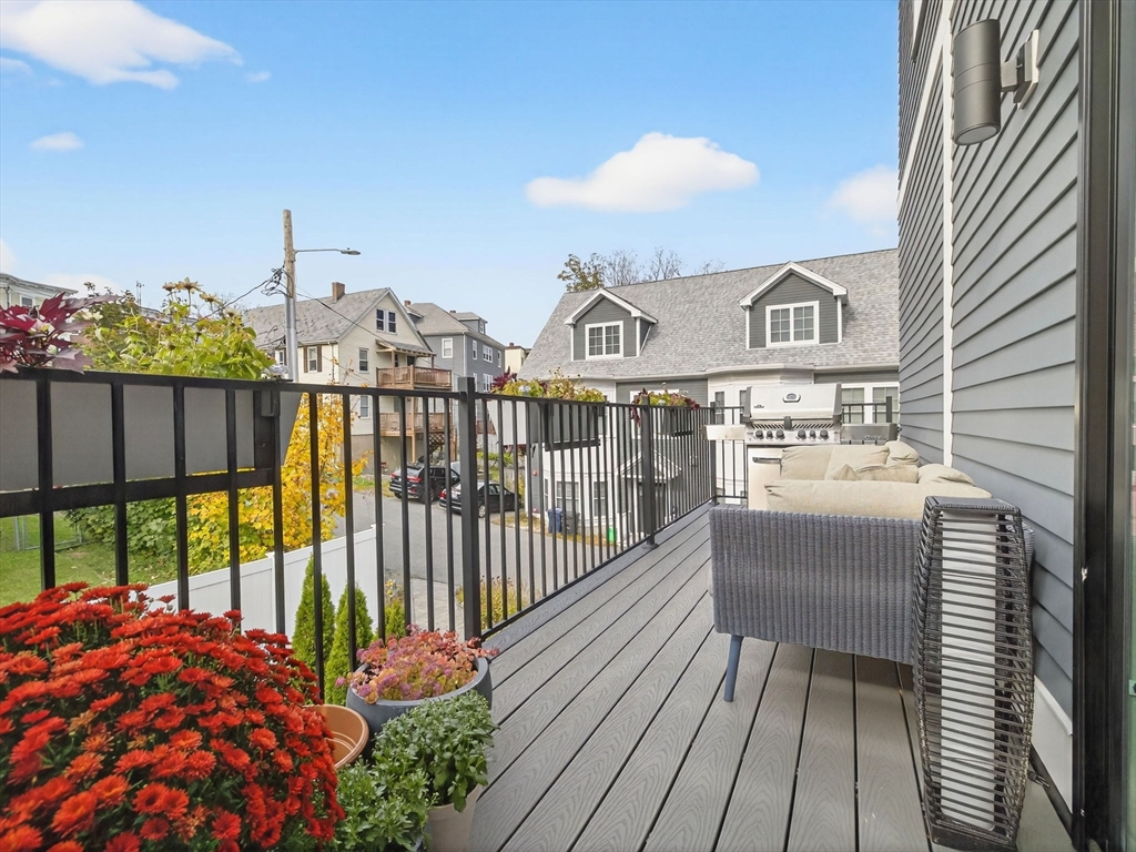 4 Payne Street, Unit 5 Boston, MA 02122 - Photo 20 of 38 a view of a balcony with wooden floor