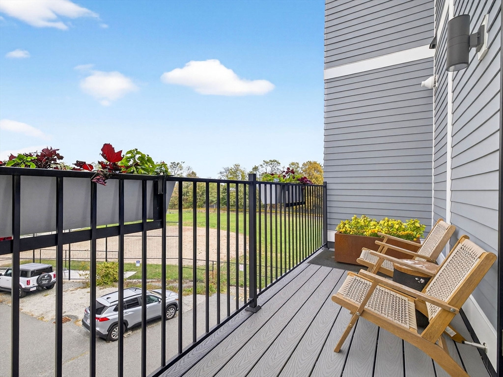 4 Payne Street, Unit 5 Boston, MA 02122 - Photo 26 of 38 a view of a chairs and table on the deck