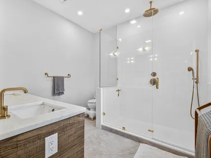 a bathroom with a sink vanity and mirror