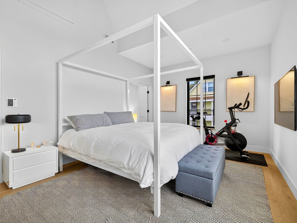 4 Payne Street, Unit 5 Boston, MA 02122 - Photo 30 of 38 a spacious bedroom with a bed and window