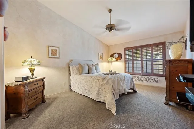 a bedroom with bed and window