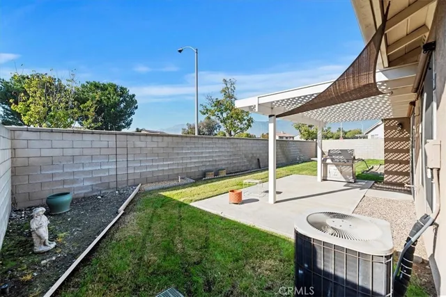 a view of a backyard with sitting area