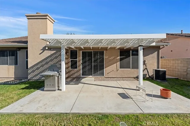 front view of a house with a patio