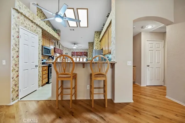 a dining room with furniture and wooden floor