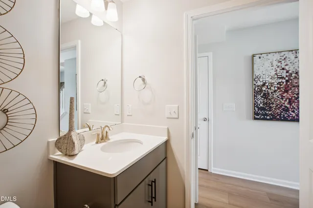 a bathroom with a sink a mirror and a shower