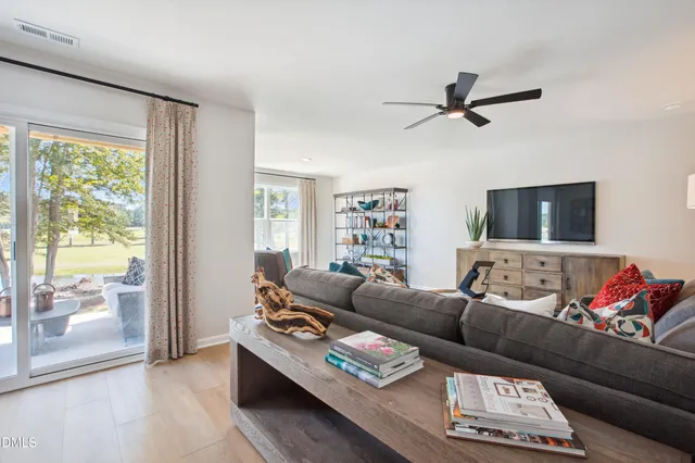 a living room with furniture and a window