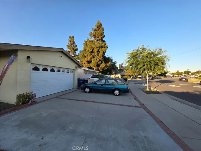 a view of street and car parked on the road