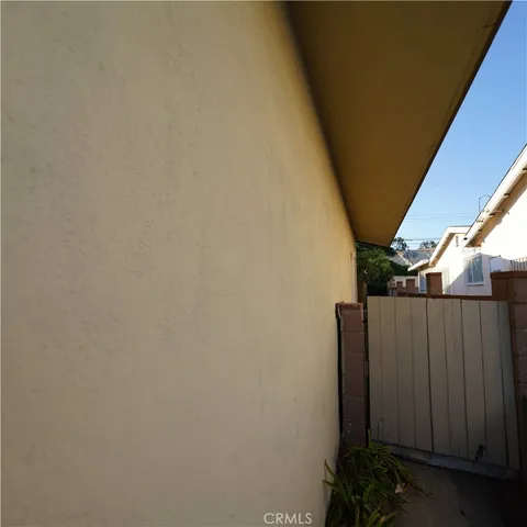 a kitchen with a stove and white cabinets