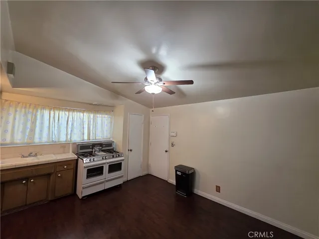 a view of a livingroom with window and hardwood floor