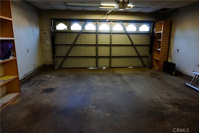 a view of a pathway of a house with wooden fence