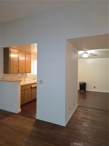 a view of a livingroom with wooden floor and air conditioner