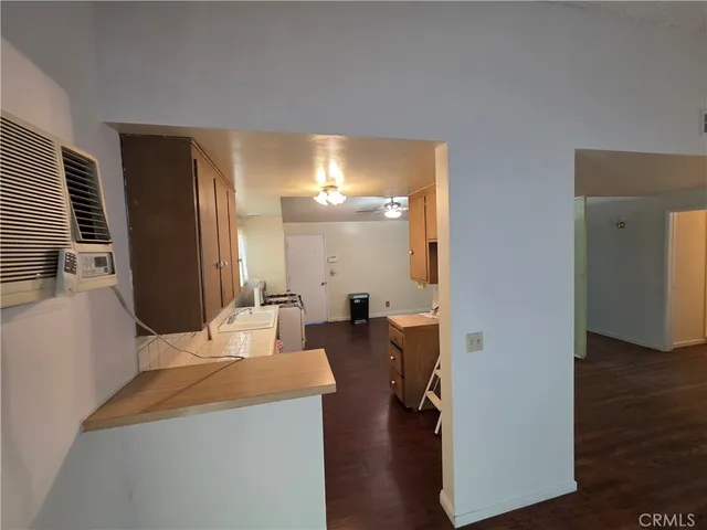 a front view of a house with a yard and a garden