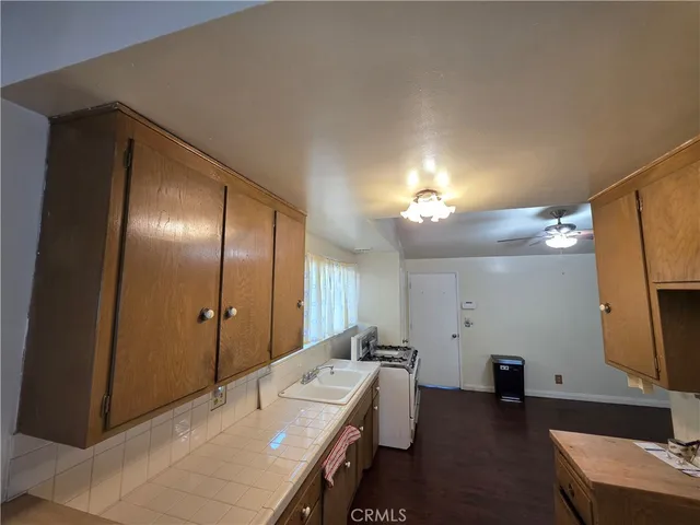 a spacious bathroom with a double vanity sink a mirror and shower