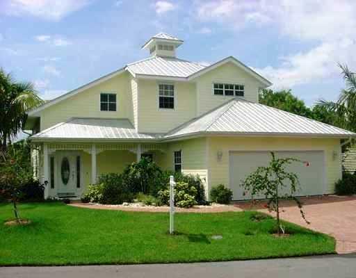 800 Southwest Salerno Road Stuart, FL 34997 - Photo 2 of 8 a front view of a house with a garden