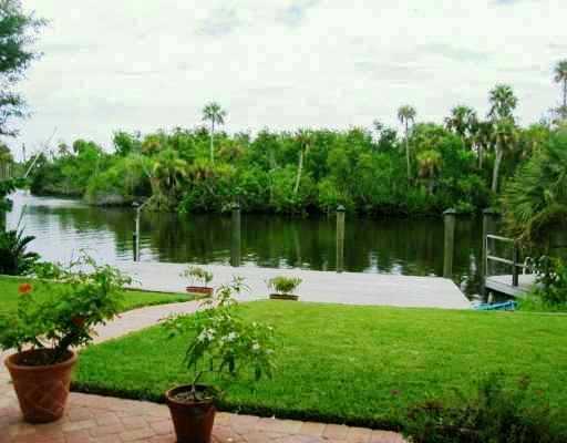 800 Southwest Salerno Road Stuart, FL 34997 - Photo 3 of 8 a lake view with a garden