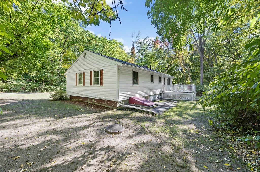 157 Spring Street Stoneham, MA 02180 - Photo 34 of 34 a backyard of a house with table and chairs