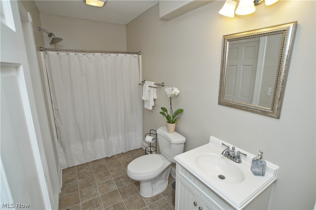 12866 Sperry Road Chesterland, OH 44026 - Photo 16 of 33 Remodeled bath has shower/tub combo and vanity.