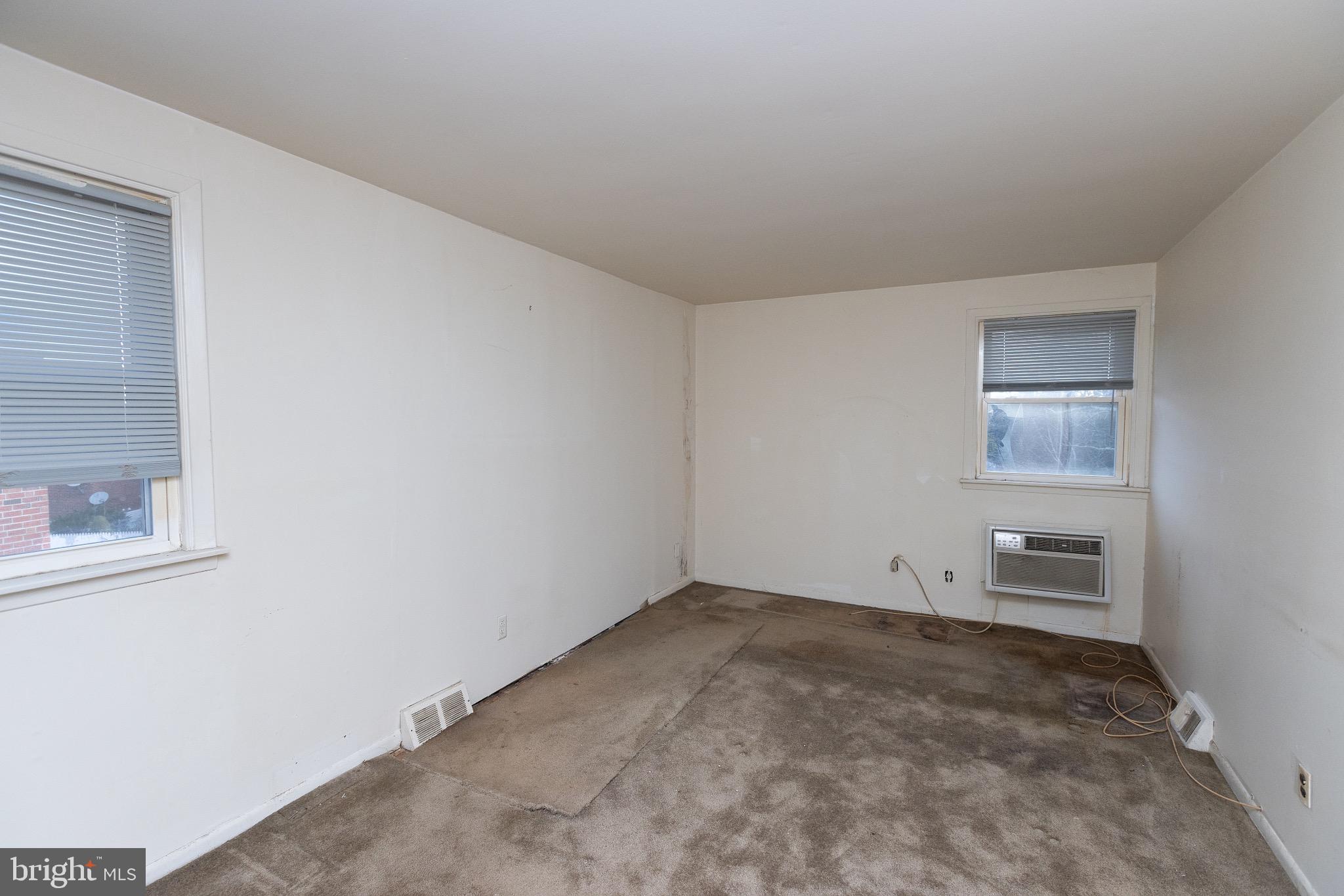 223 Alnus Street Philadelphia, PA 19116 - Photo 14 of 30 an empty room with windows and cabinet