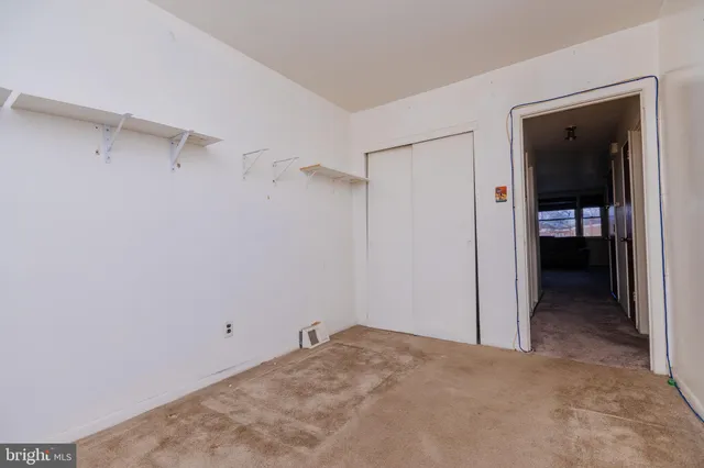 a view of hallway with wooden floor
