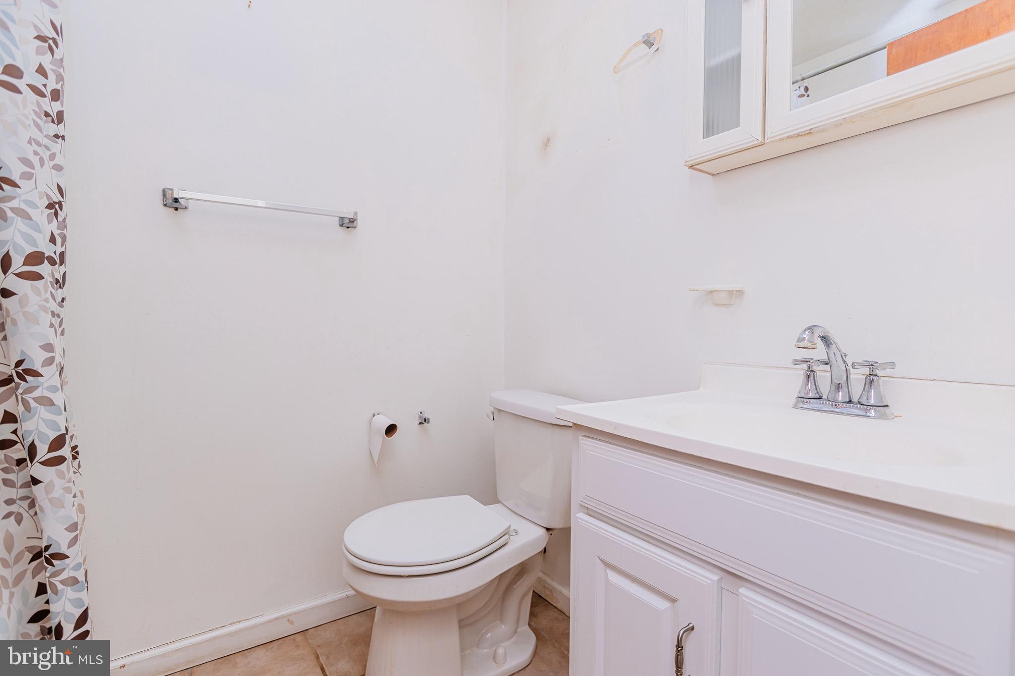 223 Alnus Street Philadelphia, PA 19116 - Photo 10 of 30 a bathroom with a sink and a toilet