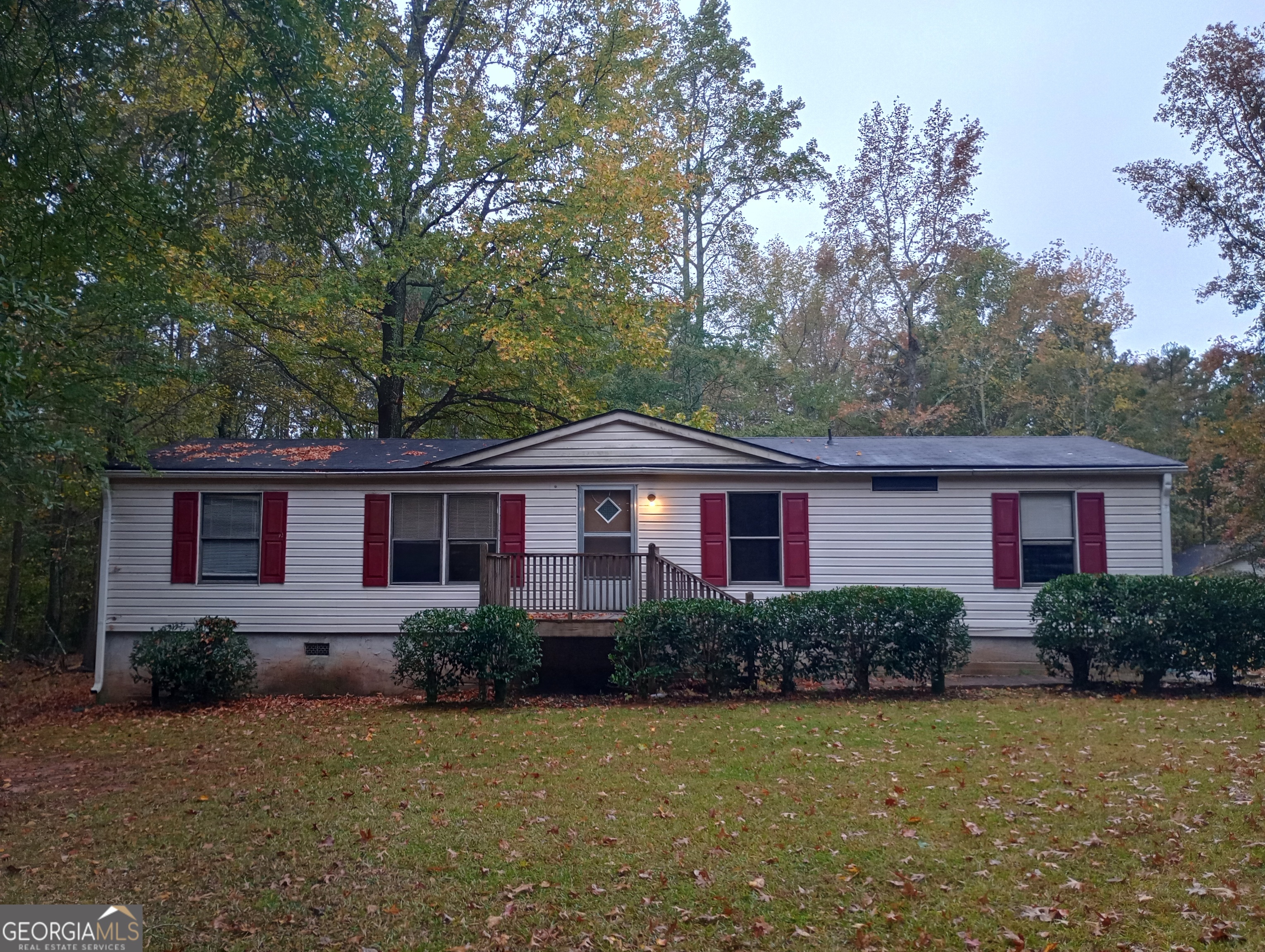 209 Walt Sanders Road, Unit A Newnan, GA 30265 - Photo 1 of 1 a front view of a house with a garden