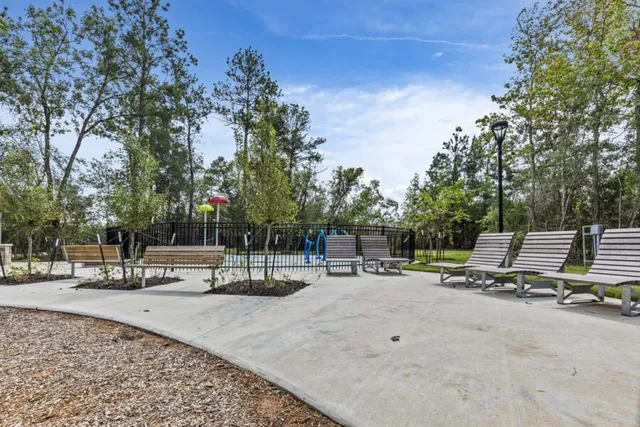 a view of a park with swings and slides